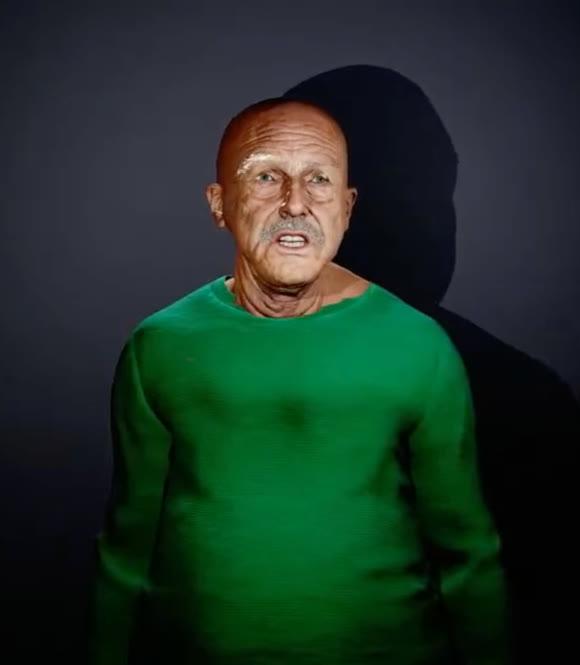 Emerson, addressing a camera against a dark backdrop